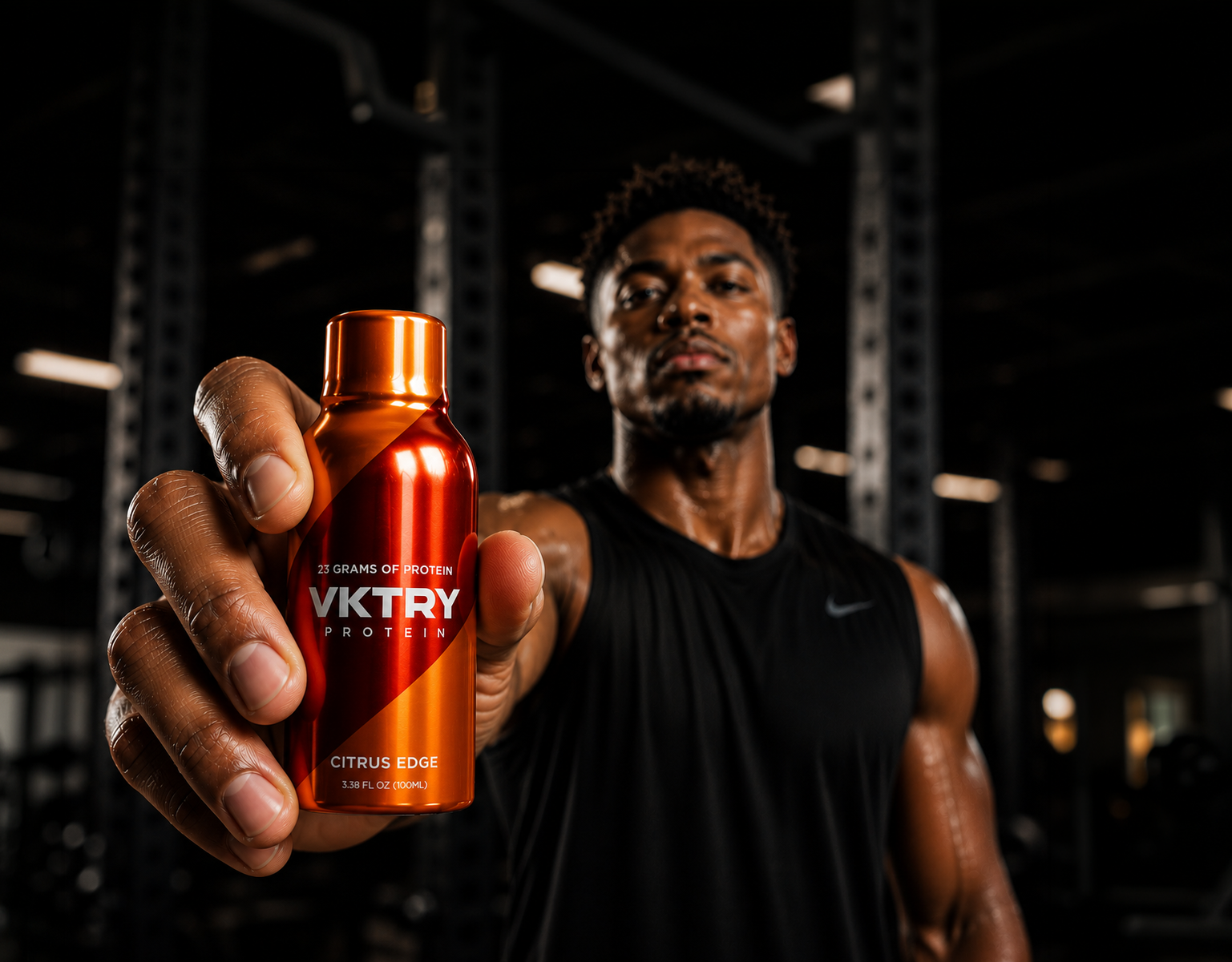 Athlete holding a VKTRY Citrus Edge protein shot